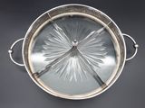 a silver plate with a starburst design on it