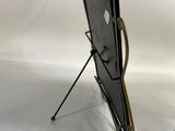 a black easel with a black board on it and a black easel with a black board on it