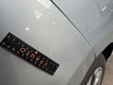 a close up of a sticker on the hood of a car