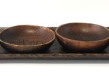 three wooden bowls on a tray with a white background