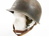 an old helmet on a mannequin head on a white surface