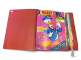 a red book with a picture of donald duck on it