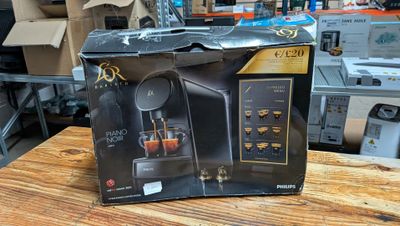 a box that has a coffee machine inside of it