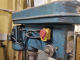 a blue machine that is sitting in a room