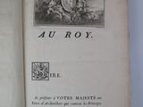 an open book with a picture of a man riding a horse on the cover