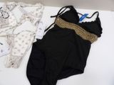 a black and gold bathing suit and a black and white one piece swimsuit