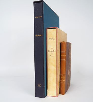 three books are stacked on top of each other on a white surface