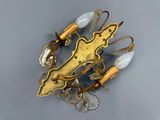 an image of a close up of a pair of earrings on a table