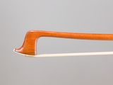 bow of a violin made of wood with a curved handle