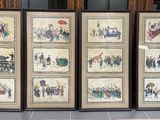 four framed pictures of people on display in a room