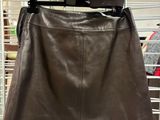 a leather skirt and jacket on display in a store