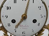 a clock that is hanging on the wall in the room