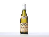 a bottle of white wine sitting on top of a table
