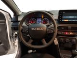 the interior of a car with a steering wheel and dashboard controls