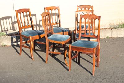 four chairs that are sitting in the parking lot