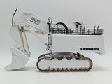 a toy excavator that is sitting on a white surface