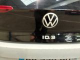 a close up of a volkswagen id3 badge on the back of a car