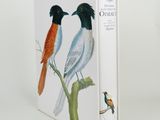 a book with two birds on it sitting on a branch