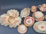 many different types of teapots and saucers on the table