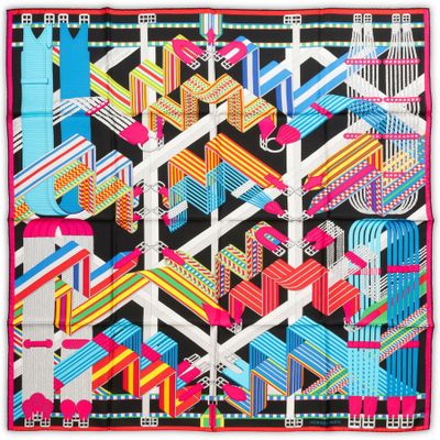 a multicolored square scarf with a geometric design
