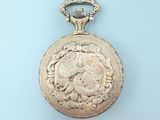 an image of a gold pocket watch on a blue background