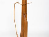 a piece of wood that has been tied up to a pole