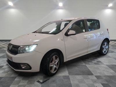 the white car is parked on a checkered tile floor