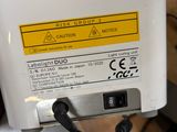 a white refrigerator with a yellow label on it