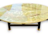 yellow marble coffee table with black legs and a marble top