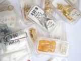 many different types of medical supplies in plastic containers