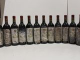 many bottles of wine lined up on a table