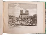 an open book with a drawing of a cathedral in the middle of it