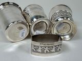 six silverplated salt shakers and a silverplated napkin ring