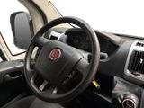 a steering wheel and dashboard of a small car