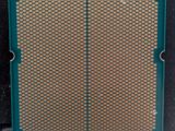 a close up of a cpu chip with a green cover