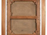 an old picture of a wooden frame with a picture in it
