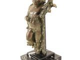 bronze statue of a boy holding a bird on a marble base