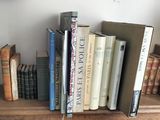 many books that are on a shelf in the room