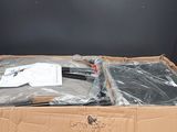 a cardboard box with a pair of scissors inside of it
