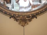 a woman taking a picture of herself in a mirror