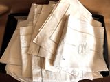 many white napkins in a black box on a table