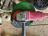 a picture of a red and green grinder sitting on top of a green bucket