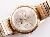 a gold wrist watch with a white dial and a gold bracelet