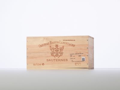 a wooden box with a label on it sitting on top of a table