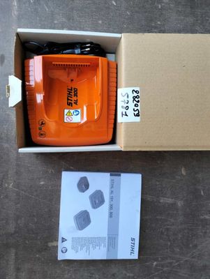 a box that has a small orange tool in it