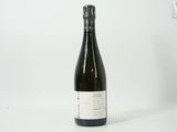 a bottle of wine that is sitting on a table