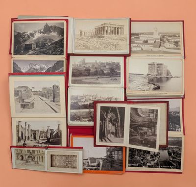a lot of old black and white photos on the wall