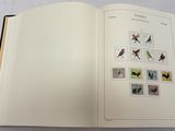 an open book with pictures of birds on it