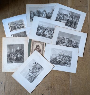 a lot of old photos on the floor of a room
