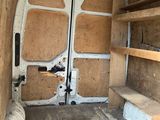 a white van that has some shelves in it